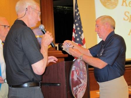 Don Williams presents Jerry Jones with an award for June 2012 presentation.jpg